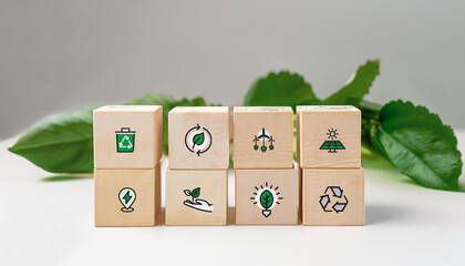 sustainable resources on wooden blocks for renewal energy systems with leaves background