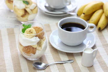 Fototapeta na wymiar homemade banana pudding and a cup of coffee, Southern dessert
