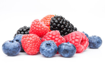 Fresh blueberry raspberry and blackberry closeup on white background