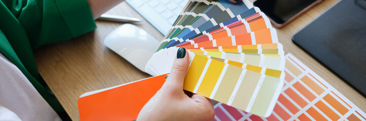 Fototapeta premium Interior designer choosing fan of colourful samples