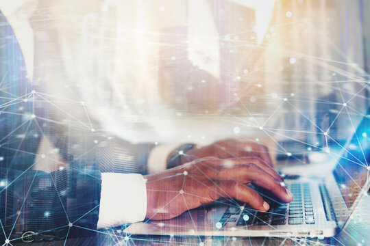 Businessman works with laptop and Futuristic lights on screen. Global internet connection and streaming concept