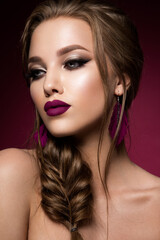 Glamour portrait of beautiful girl model with makeup and romantic hairstyle. Fashion shiny highlighter on skin, sexy gloss lips make-up and dark eyebrows. Pink lips