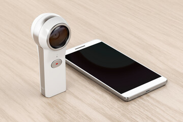 360 degree camera and smartphone on wood background