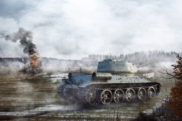 Fototapeta na wymiar Soviet Tank goes through the swamp in the background of a burning tank. Tank battle on the battlefield