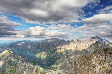 View on high Tatra Mountains from Rysy mountain with dramatic cloudy sky