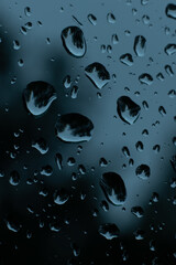Water drops on glass. Raindrops on the car glass. Thunderstorm Climatic rain on window glass
