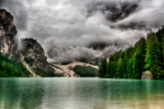 Pragser Wildsee in the morning with the clouds in front of the mountains, Trentino-Alto Adige, Sud Tirol, Italy
