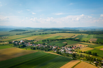 Fototapeta na wymiar Bobolice, aerial view of polish village, Lower Silesian landscape. Drone view of beautiful, countryside landscape. 