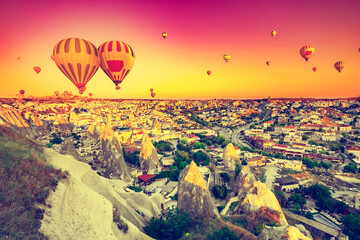 Hot air balloons flying over spectacular Cappadocia