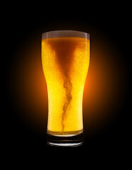 Glass of golden beer with foam