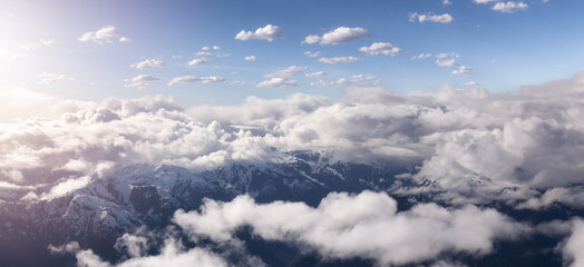 Canadian Coastal Mountain Landscape covered in Clouds. Aerial Panorama