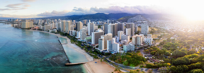 Sunrise panoramic view of the densest parts of Honolulu at Waikiki and its beach and hotels