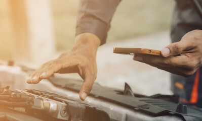 Automobile mechanic repairman hands repairing a car engine automotive workshop with a wrench, car service and maintenance,Repair service.