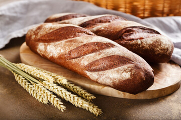 Freshly baked baguette close up. Food background.