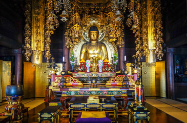 Fototapeta na wymiar Golden Buddha inside Chion-In Temple, Kyoto, Japan