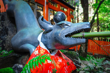 Fototapeta na wymiar Fox purification fountain at Fushimi Inari Taisha torii shrine, Kyoto, Japan