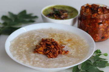 Kanji and Kadumanga. Rice gruel prepared with Kerala Matta rice. Served with raw banana curry and...
