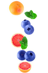 Isolated flying berriesgrapefruit and mint on white background with clipping path