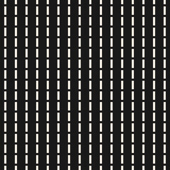 Dash line pattern. Vector monochrome seamless texture with vertical parallel lines. Abstract black and white background. Simple monochrome ornament. Perforated surface. Dark minimal repeat design