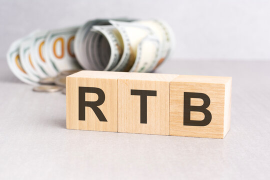 word RTB on wooden cubes, grey background
