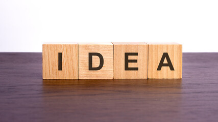idea written in wooden cubes. conceptual word collected of wooden elements with the letters. stock image, brown background