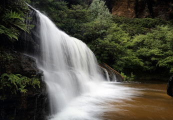 Fototapeta na wymiar Beautiful waterfall in magnificent full flow