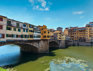 Medieval stone closed-spandrel segmental arch bridge Ponte Vecchio over Arno river in Florence, the capital city of Tuscany region, Italy.