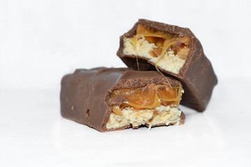 pieces of chocolate bars lie on a white background