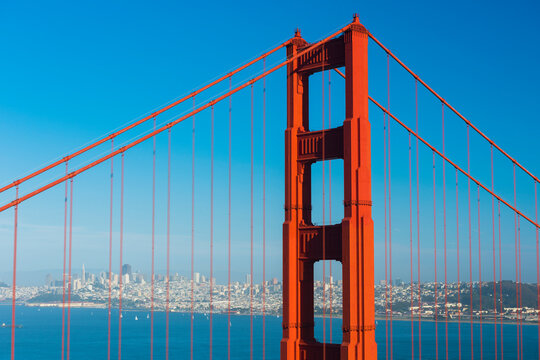 City of San Francisco seen through wires of the Golden Gate Bridge. California, USA