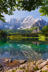 Picturesque mountain scenery and hiking place. Beautiful superior Fusine lake and Mangart mountain...