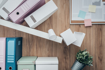 Office shelf crashing and folders falling down, failure and disaster concept