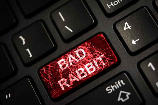 Message on broken red enter key of keyboard. Computer Bad Rabbit virus attack. Copy space