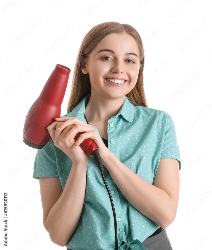 Wall mural Female hairdresser with dryer on white background