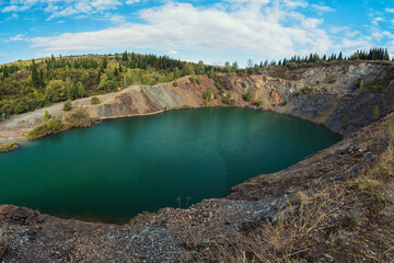 Blue lake in Altai. This is a former copper mine that was flooded with water
