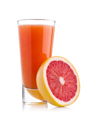 Glass of fresh grapefruit juice with fruit on white background