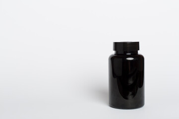 Plastic bottle for vitamins on color background