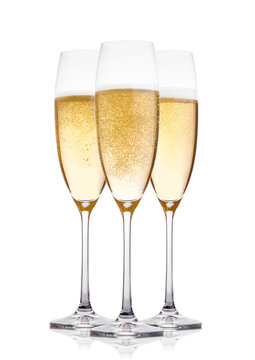 Yellow champagne glasses with bubbles isolated on white background