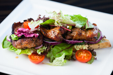 Club Sandwich with whole wheat bread baguettes, fresh salads, vegetables, brie cheese and sun-dried tomato cream