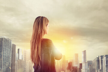 Businesswoman looks far for the future. double exposure