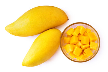 Two mango fruits and mango cubes on a plate. Isolated on white background