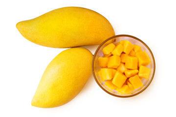 Two mango fruits and mango cubes on a plate. Isolated on white background