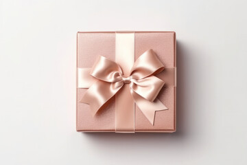 Gift box wrapped with craft paper and bow on neutral background with boke.