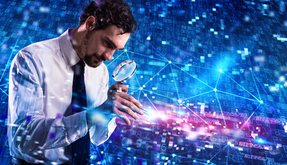 Businessman analyzes a computer system for virus and hacker attacks with lens