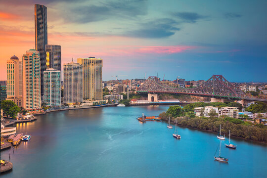 Cityscape image of Brisbane skyline, Australia during dramatic sunset.
