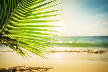 Obraz na płótnie Canvas vibrant green palm leaf against a turquoise ocean background on a sandy beach