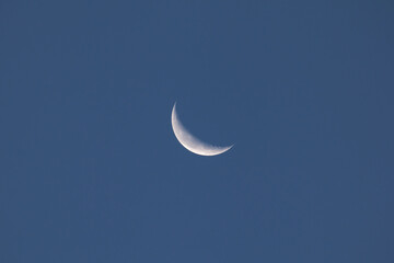 Obraz na płótnie Canvas Waning Crescent Moon during the evening of 15 October 2017 over Sussex, England.