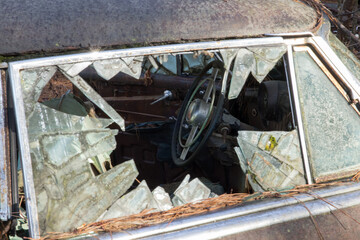 Fototapeta na wymiar Broken auto glass in a junk yard