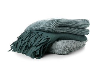 Different soft folded blankets on white background