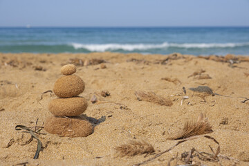 Ocean balls of posidonia seaweed balanced on the beach. Inspirational summer landscape. Spa or...