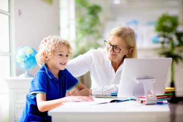 Obraz premium Online remote learning. School kids with computer.